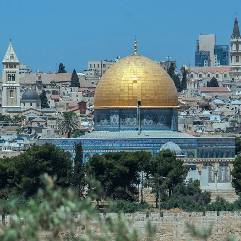 Jerusalem private tour: the Dome of the Rock and the Old City from the Mount of Olives The golden Dome of the Rock rises above the stone houses and church towers of Jerusalem's Old City, seen across the city wall from the Mount of Olives.